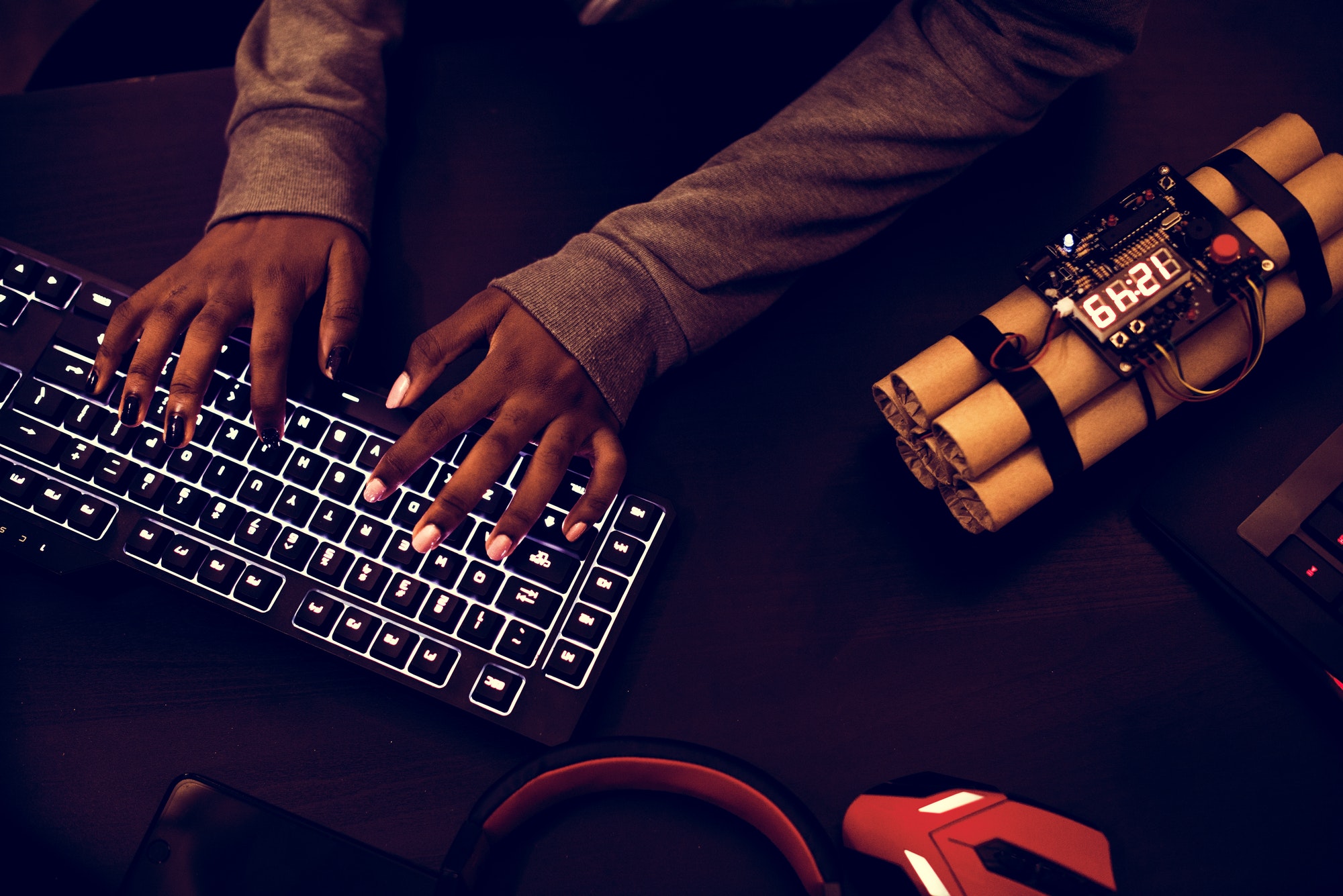 Hacker hacking and bomb on the side